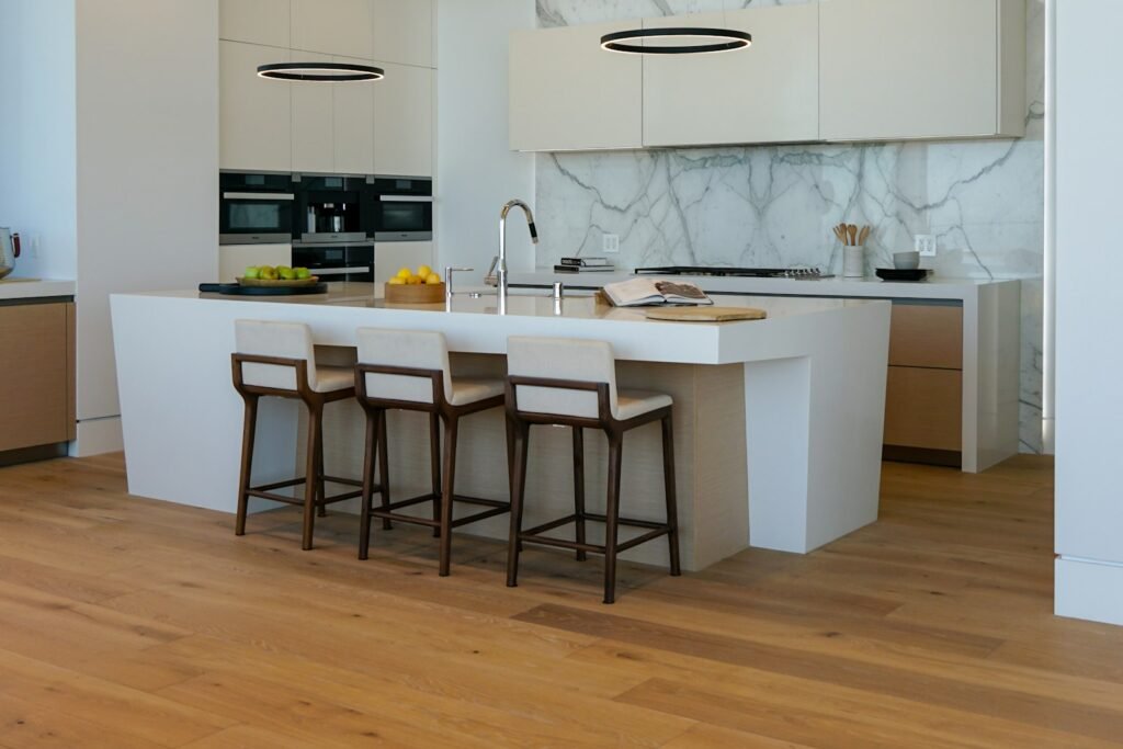 White kitchen with a center island and breakfast bar