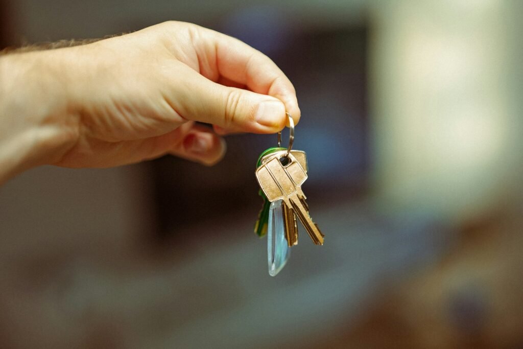 Hand holding a set of house keys